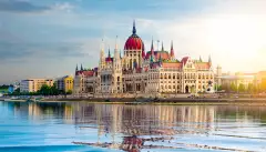 The Hungarian Parliament building over the Danube river at sunset in Budapest, Hungary